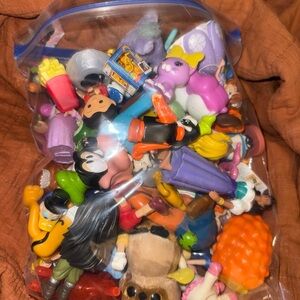 Overflowing gallon baggy of Assorted Disney Kids Toy Figures Set